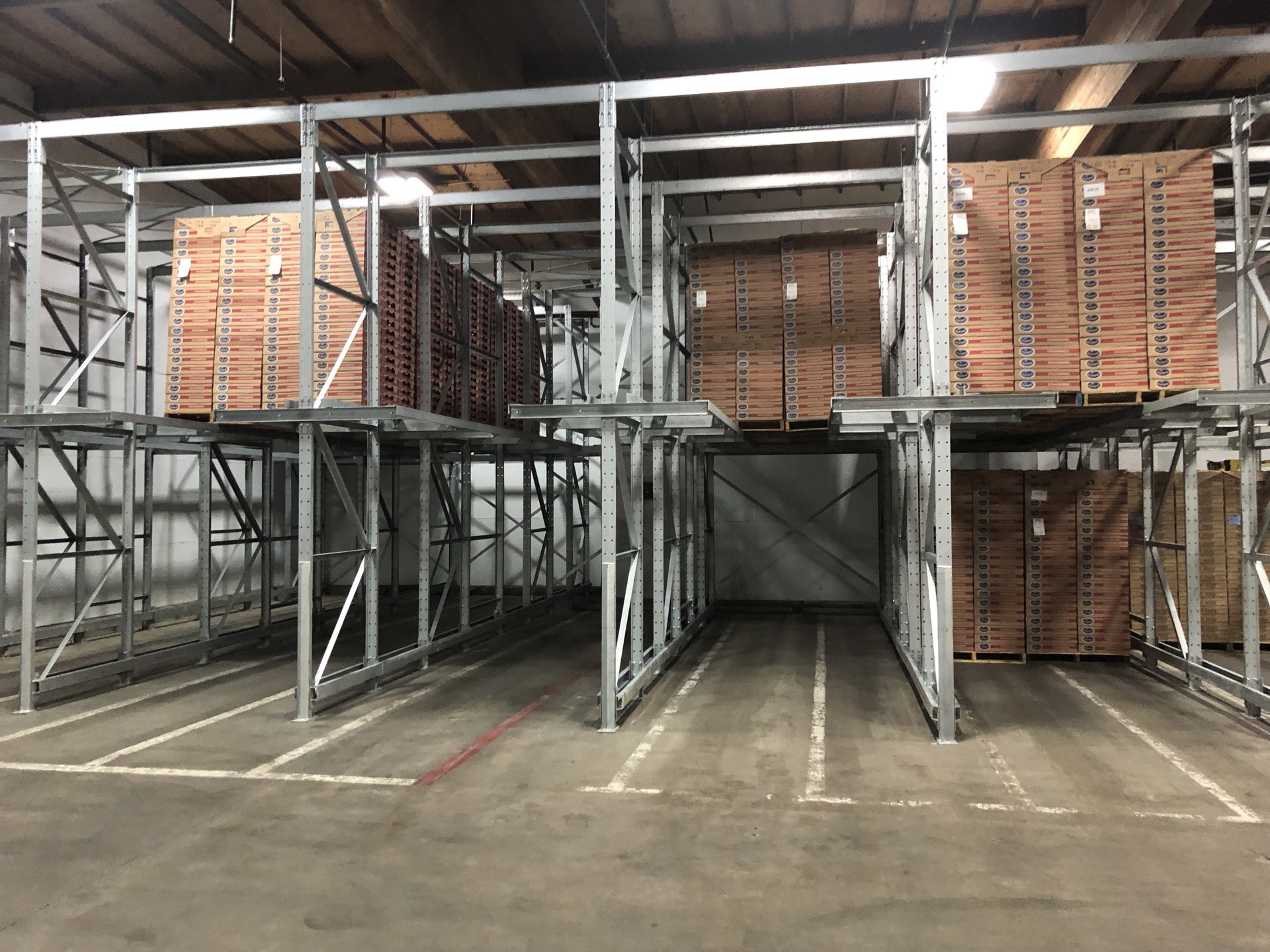 Twin pick drive-in lanes loaded with stacked crates