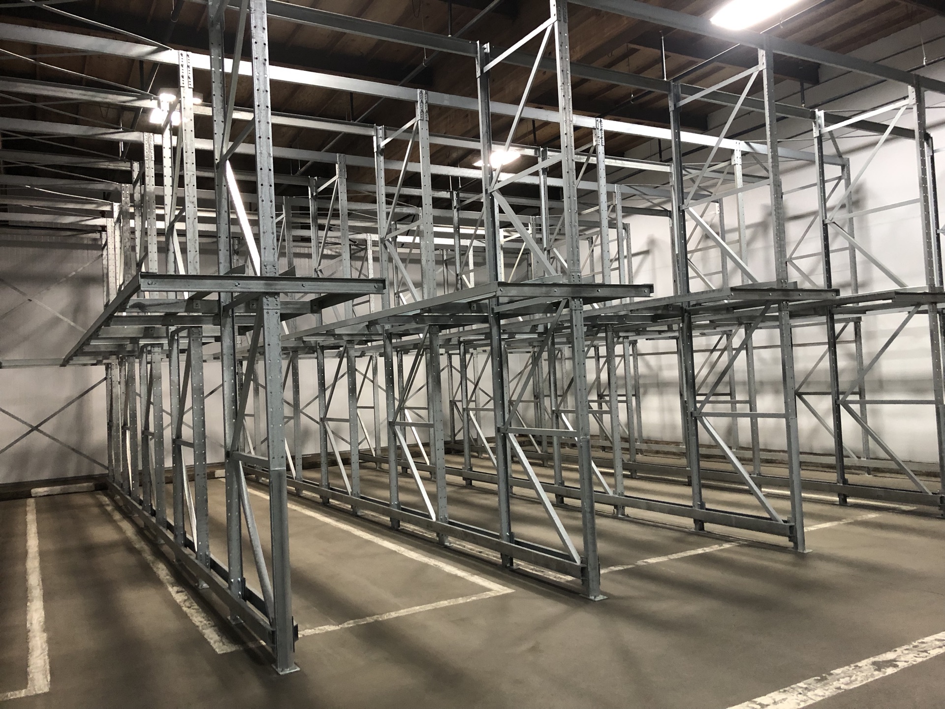Empty dual-pallet drive-in rack viewed at an angle