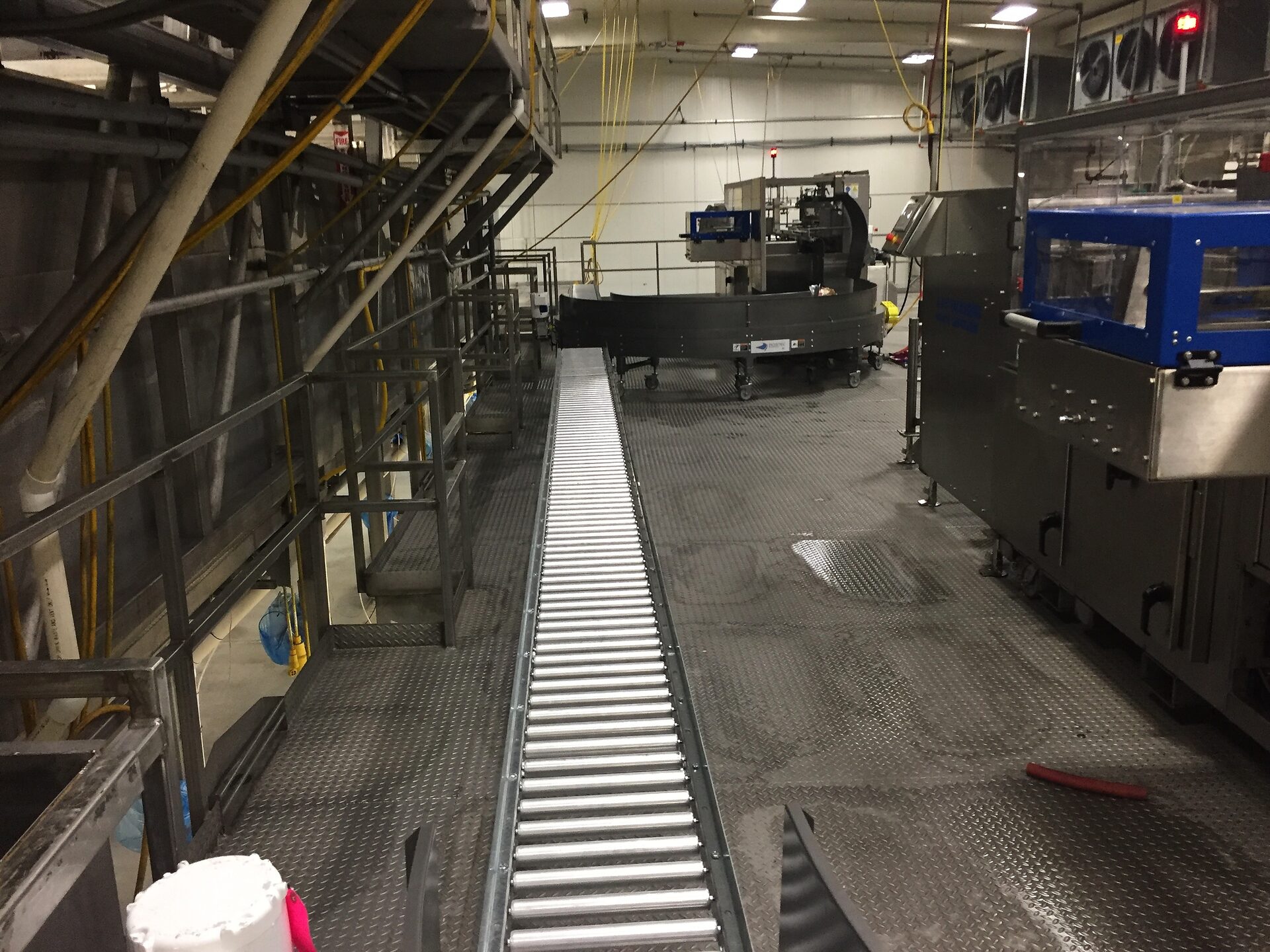 Elevated catwalk over packaging line equipment
