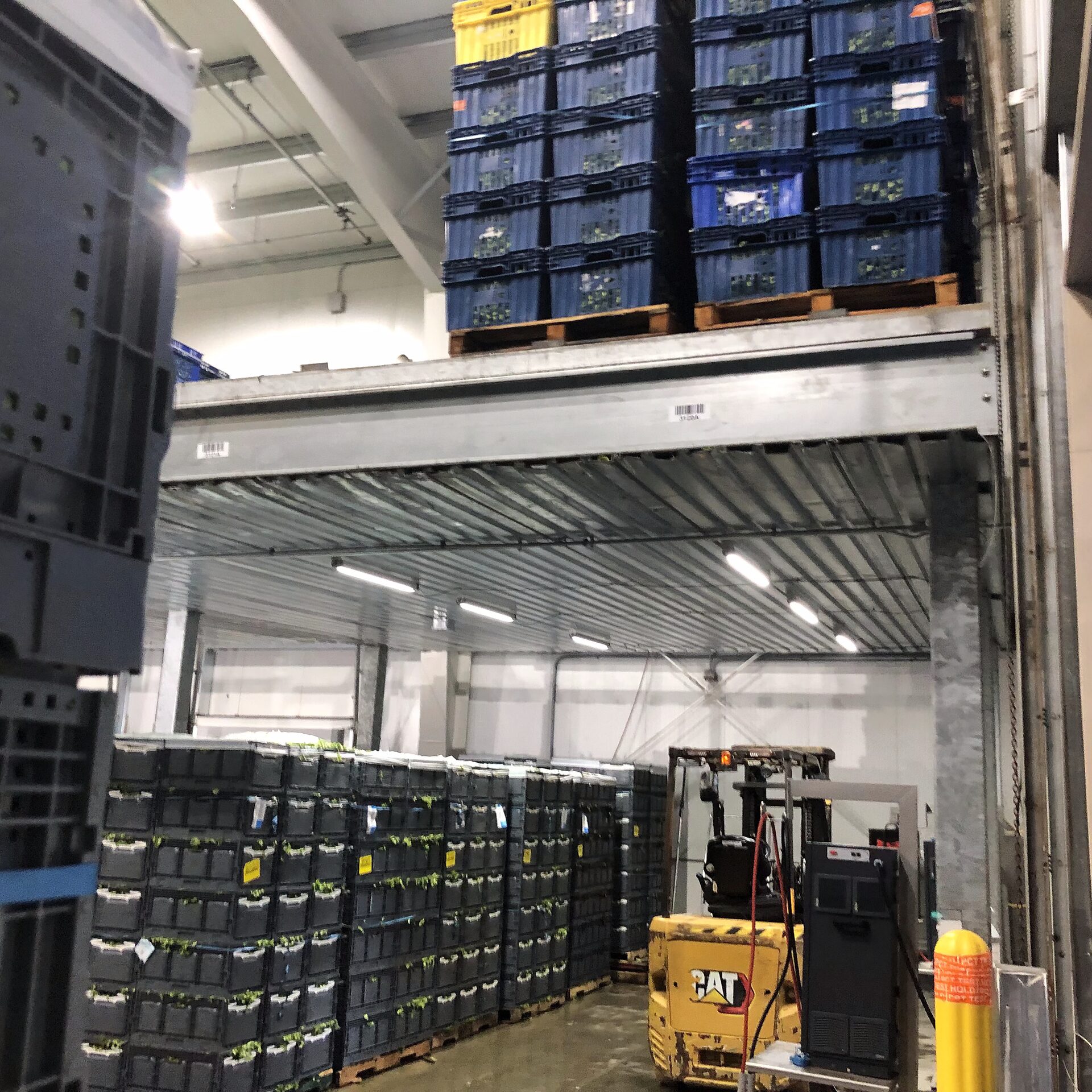 Produce crate storage on a mezzanine above forklift traffic